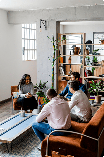 Image of four cannabis experts discussing state regulations in a lounge setting