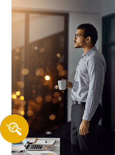 An individual stands in an office at night contemplating how to increase marketing ROI with cannabis data research strategies. An individual stands in an office at night contemplating how to increase marketing ROI with cannabis data research strategies.
